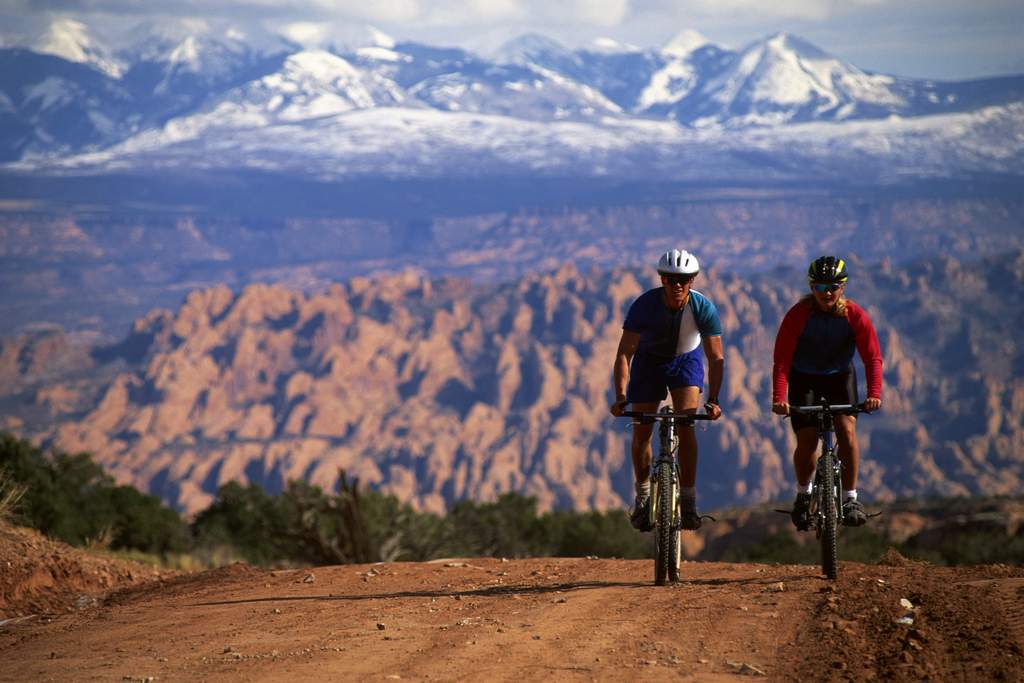 Couple mountain-biking